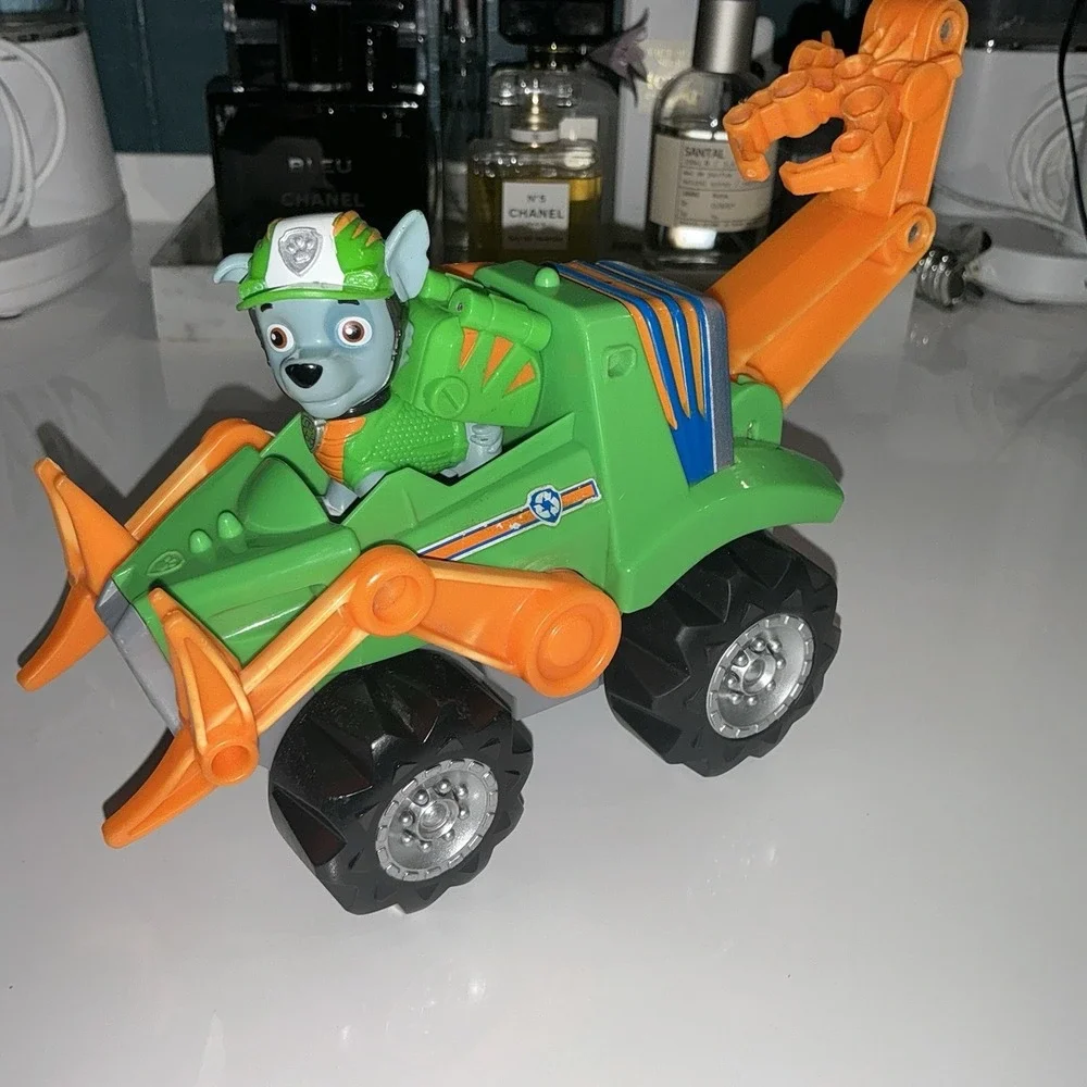 Paw Patrol Rocky Rev Up Deluxe Dino Rescue Vehicle with Dinosaur & Figure